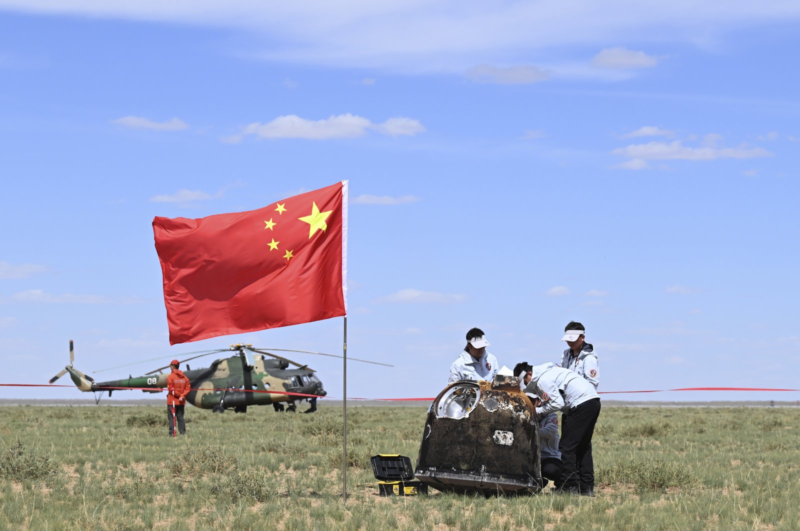 Workers access the returned capsule of the Chang&#039;e 6 probe in Siziwang Banner, northern China&#039;s Inner Mongolia Autonomous Region, June 25, 2024. (AP Photo)