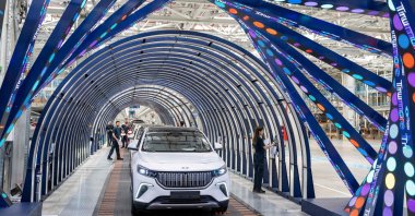 This photograph shows employees working on a car assembly line at a factory of Togg at the Gemlik Togg Technology Campus, Bursa, northwestern Türkiye, May 17, 2024. (AFP Photo)