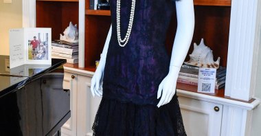 Princess Diana's 1987 Victor Edelstein magenta silk and lace evening dress is displayed in "Princess Diana's Elegance & a Royal Collection," Beverly Hills, California, U.S., June 25, 2024. (AFP Photo)