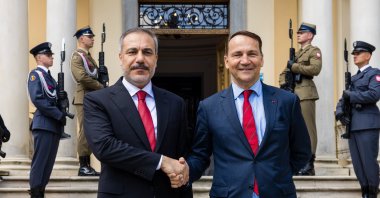 Foreign Minister Hakan Fidan (L) and Polish Foreign Minister Radoslaw Sikorski shake hands before a meeting in Helenow, central Poland, June 26, 2024. (IHA Photo)