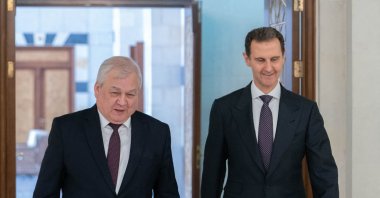 Syrian President Bashar Assad (R) meeting with the Russian President&#039;s special envoy to Syria Alexander Lavrentiev in Damascus, June 26, 2024. (Photo by SANA / AFP)