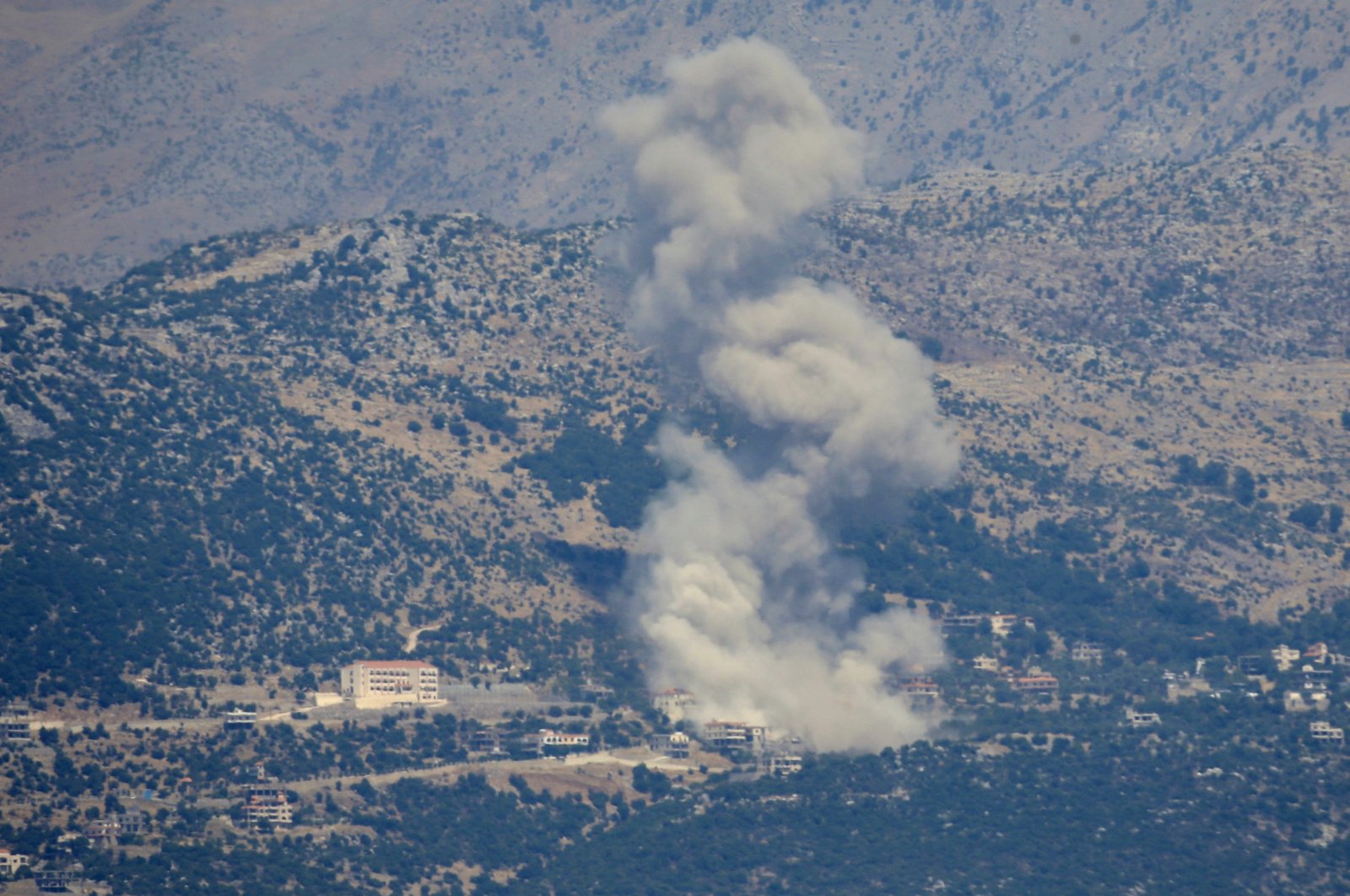  Smoke billows after an Israeli bombardment on the village of Kfarshuba near the border with Israel, in Lebanon, June 26, 2024. (EPA Photo)
