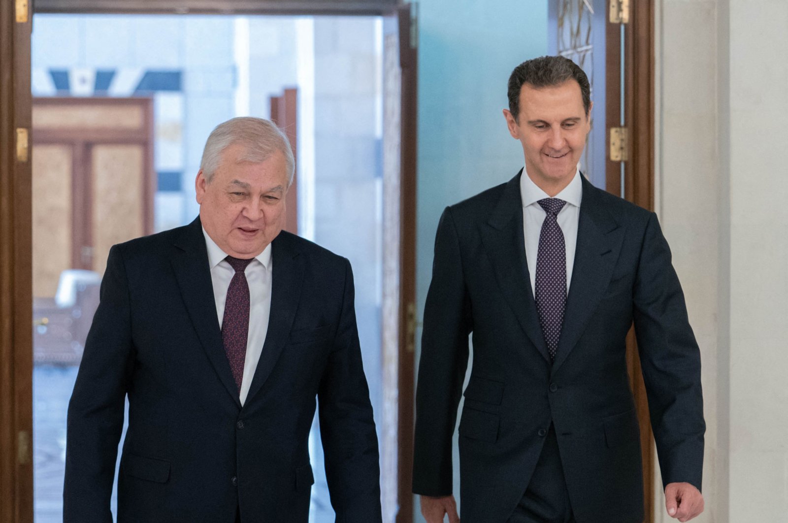 Syrian President Bashar Assad (R) meeting with the Russian President&#039;s special envoy to Syria Alexander Lavrentiev in Damascus, June 26, 2024. (Photo by SANA / AFP)