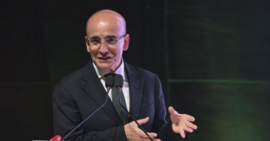 Treasury and Finance Minister Mehmet Şimşek delivers a speech at the summit in Istanbul, Türkiye, June 8, 2024. (AA Photo)
