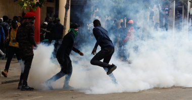 People react to tear gas during a demonstration in Nairobi, Kenya, June 27, 2024. (Reuters Photo)