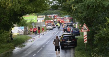 Firefighting and emergency vehicles on the site of the collision of a bus with a train near the town of Nove Zamky, Slovakia, June 27, 2024. (AP Photo)