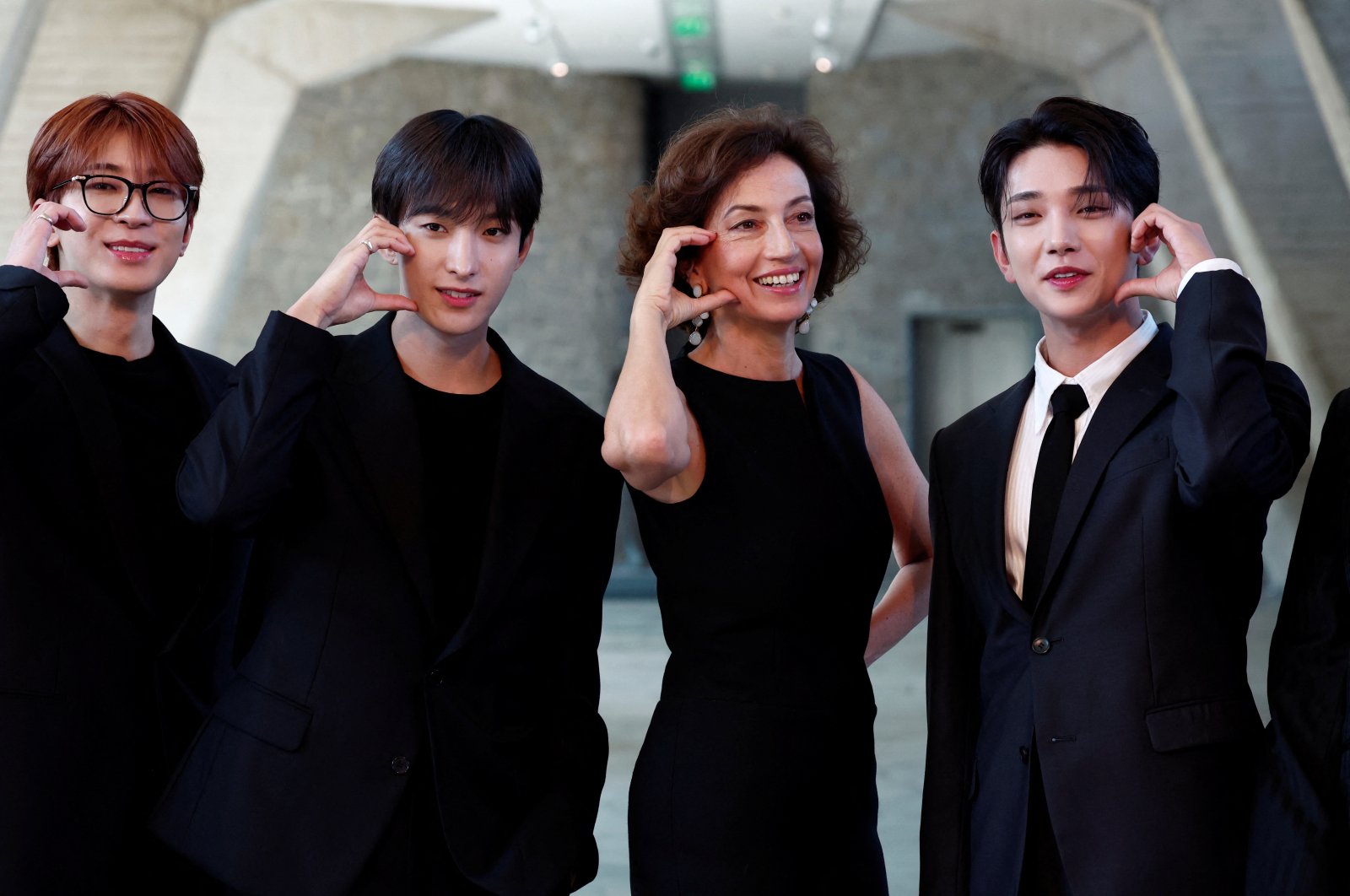 UNESCO Director-General Audrey Azoulay and members of South Korean boy band Seventeen pose during a photocall before their nomination ceremony as goodwill ambassadors for youth at the UNESCO headquarters in Paris, France, June 26, 2024. (Reuters Photo)