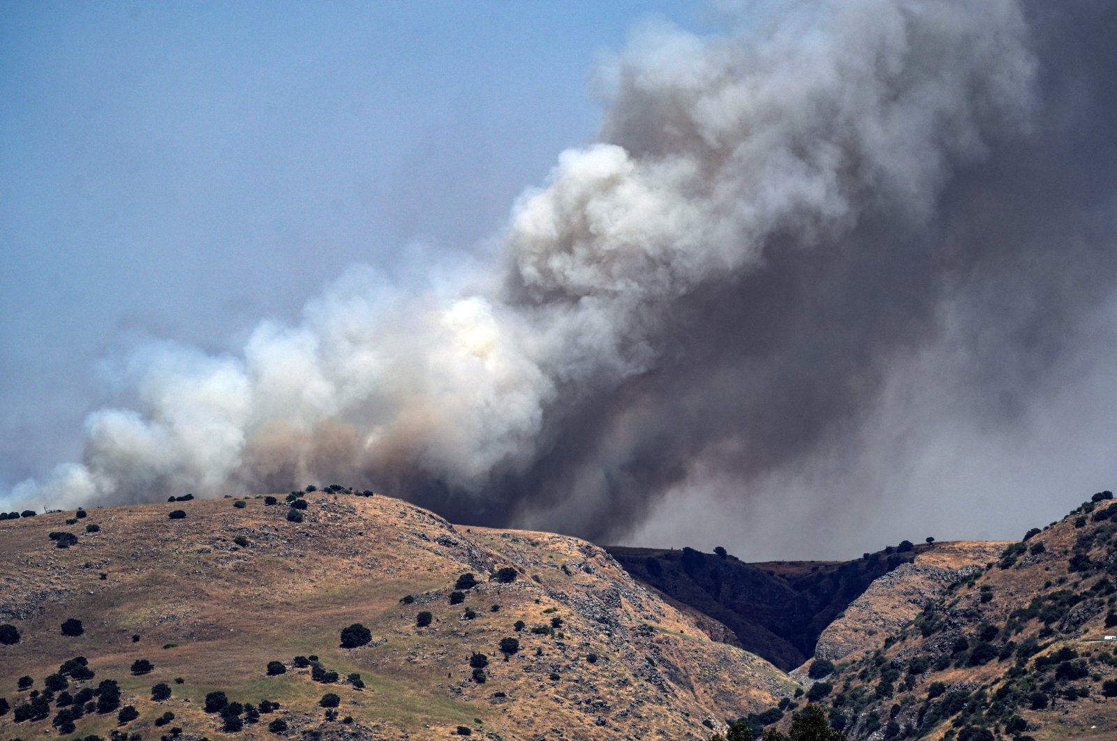
Smoke rises following over border attacks from Lebanon, amid ongoing cross-border hostilities between Hezbollah and Israeli forces, in the Israeli-occupied Golan Heights June 13, 2024. (Reuters Photo)