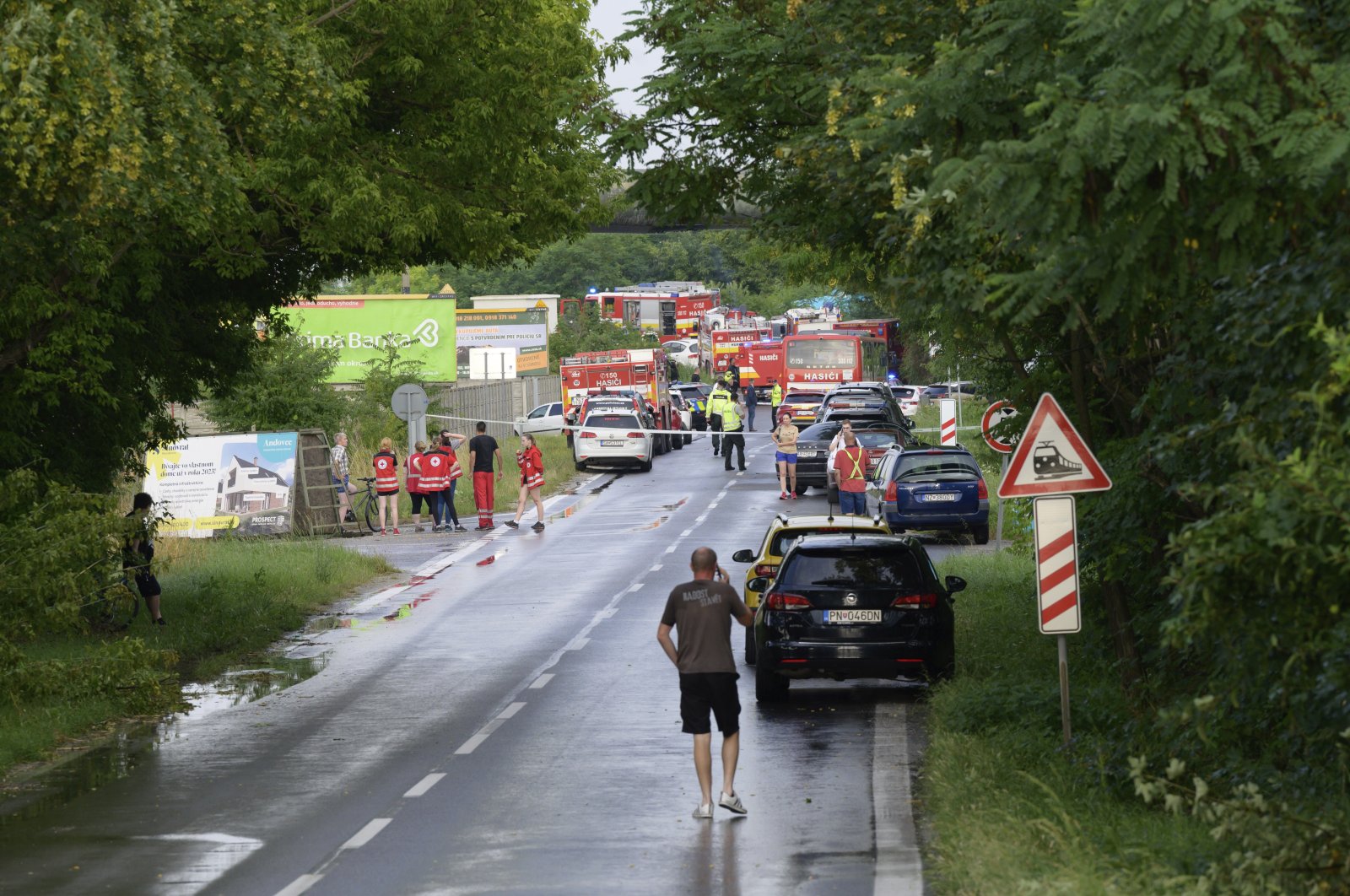 Firefighting and emergency vehicles on the site of the collision of a bus with a train near the town of Nove Zamky, Slovakia, June 27, 2024. (AP Photo)