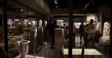 People visit the newly opened permanent &quot;Excavation&quot; exhibition, also known as &quot;The Museum under the Museum,&quot; at the modern Acropolis Museum, Athens, Greece, June 27, 2024. (Reuters Photo)