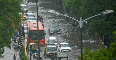 Vehicles wade through flooded streets after heavy rains, New Delhi, India, June 28, 2024. (AFP Photo)