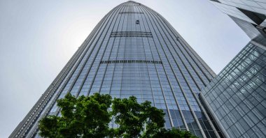 A special "gondola" (top C) used by window cleaners high up on the Lotte World Tower, South Korea's tallest building, Seoul, South Korea, June 5, 2024. (AFP Photo)
