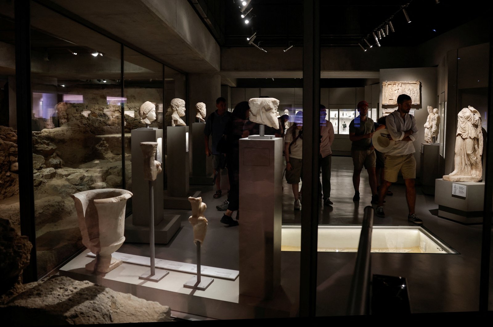 People visit the newly opened permanent &quot;Excavation&quot; exhibition, also known as &quot;The Museum under the Museum,&quot; at the modern Acropolis Museum, Athens, Greece, June 27, 2024. (Reuters Photo)