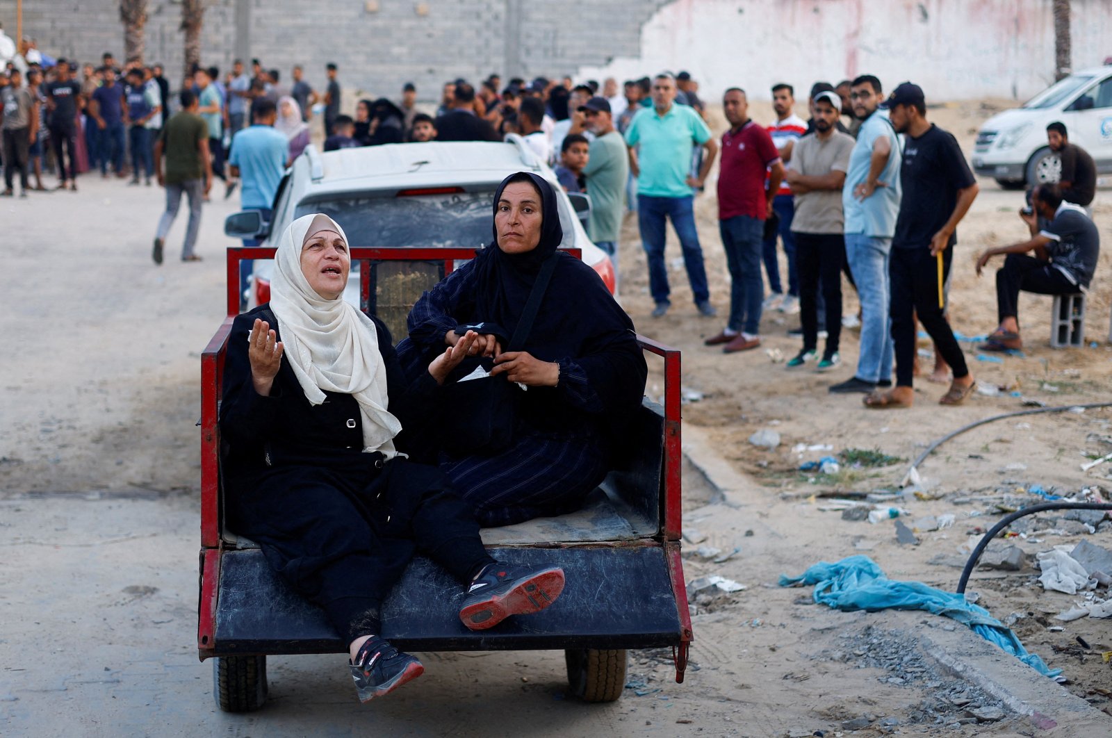 People react following an Israeli strike that hit a tent camp, amid the ongoing conflict between Israel and Hamas, in al-Mawasi area in western Rafah, in the southern Gaza Strip, June 21, 2024. (Reuters File Photo)