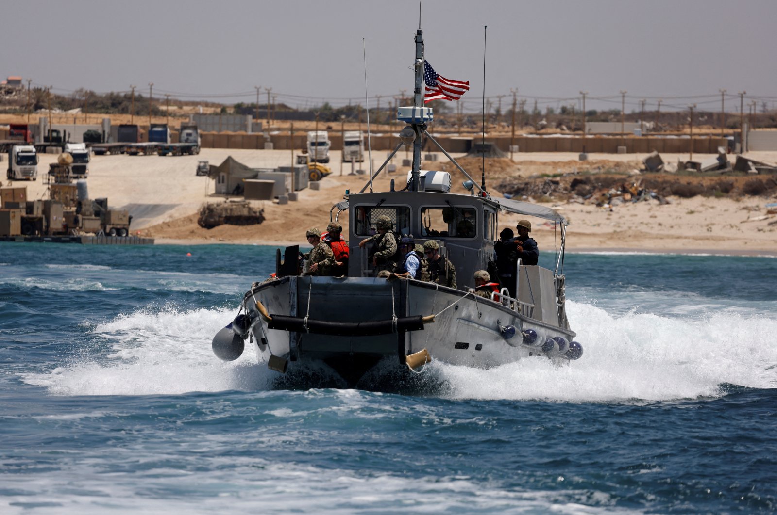 An American boat carrying American soldiers and journalists sails near the Trident Pier, a temporary pier to deliver aid, off the Gaza Strip, June 25, 2024. (Reuters Photo)