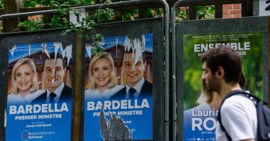 Legislative election posters on billboards, including French member of parliament and previous candidate for French presidential election Marine Le Pen (L) and leader of the French extreme right party Rassemblement National (RN, National Front) Jordan Bardella (R), are displayed outside of polling station in Malakoff, near Paris, France, June 29, 2024. (EPA Photo)