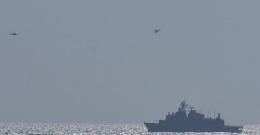 In this photo provided by the Greek Defense Ministry, air force jets and a warship take part in a military exercise in Eastern Mediterranean sea, Aug. 25, 2020. (AP Photo)
