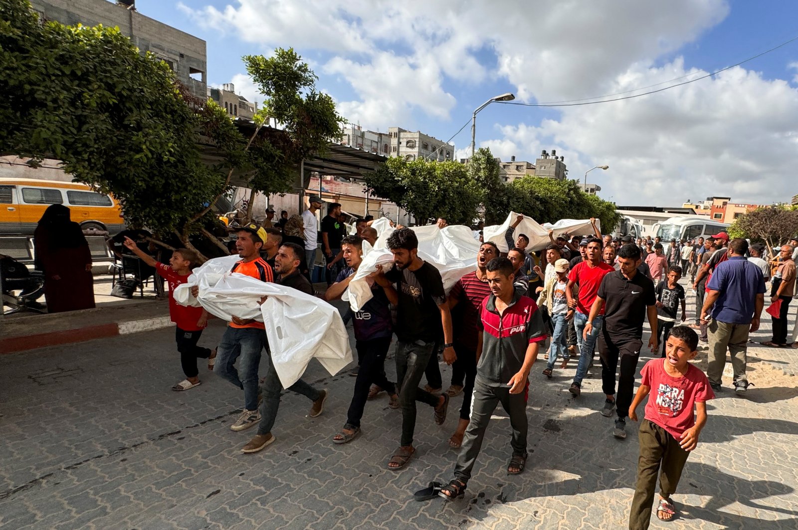 Mourners carry the bodies of Palestinians from the Zourob family who were killed in an Israeli strike, Khan Younis, Gaza Strip, Palestine, June 30, 2024. (Reuters Photo)