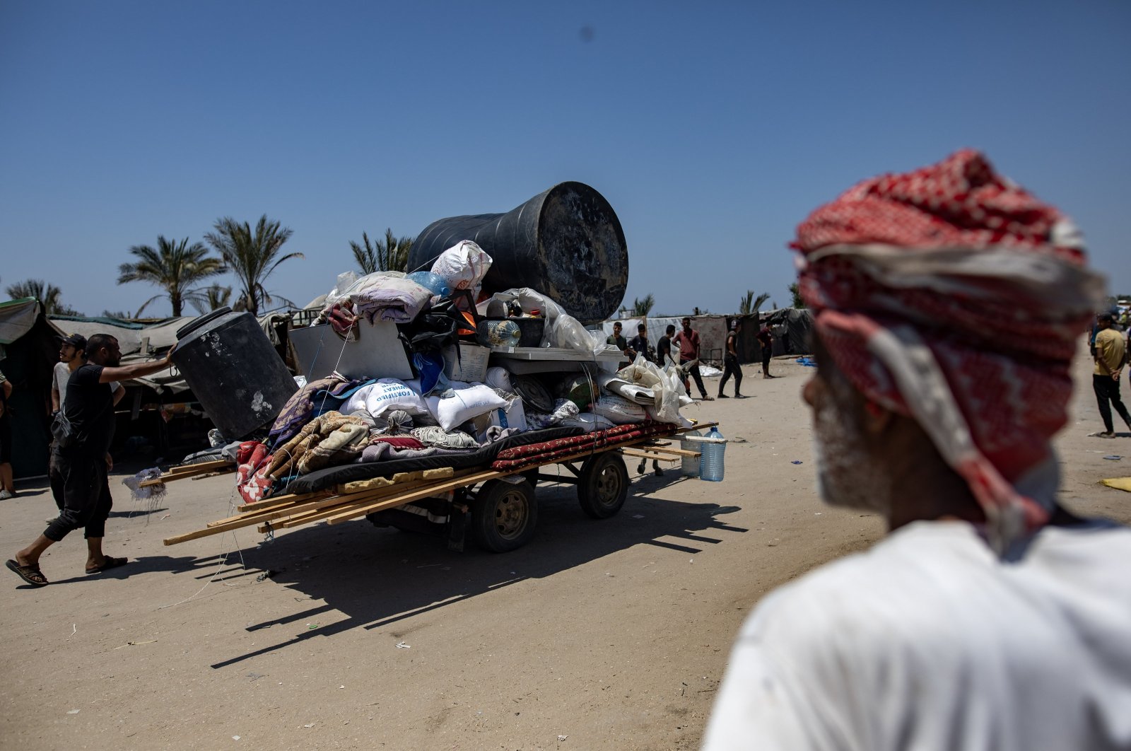 Palestinians flee displacement camps after the advance of Israeli army vehicles west of the city of Rafah, in the southern Gaza Strip, Palestine, June 28, 2024. (EPA Photo)