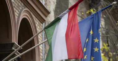 A Hungarian and a European Union flag is seen on a building in downtown Budapest, Hungary, Nov. 20, 2023. (AP Photo)