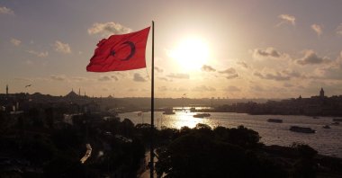 A drone view shows a Turkish flag flying over Sarayburnu with the Golden Horn in the background, Istanbul, Türkiye, June 21, 2024. (Reuters Photo)