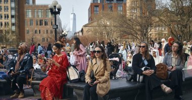 People watch as Muslims gather to perform an Eid al-Fitr prayer, marking the end of the fasting month of Ramadan at Washington Square Park in New York, April 10, 2024. (AP File Photo)