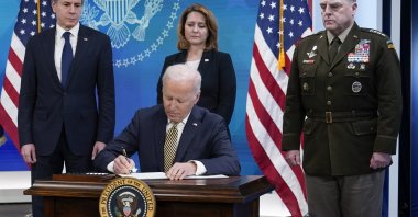 President Joe Biden signs a delegation of authority in the South Court Auditorium on the White House campus in Washington, Wednesday, March 16, 2022. (AP File Photo)