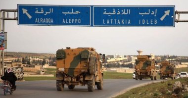 Turkish military vehicles drive in a convoy headed for the south of Idlib province as they pass by the town of Atareb in the western countryside of Aleppo on Feb. 3, 2020. (AFP File Photo)