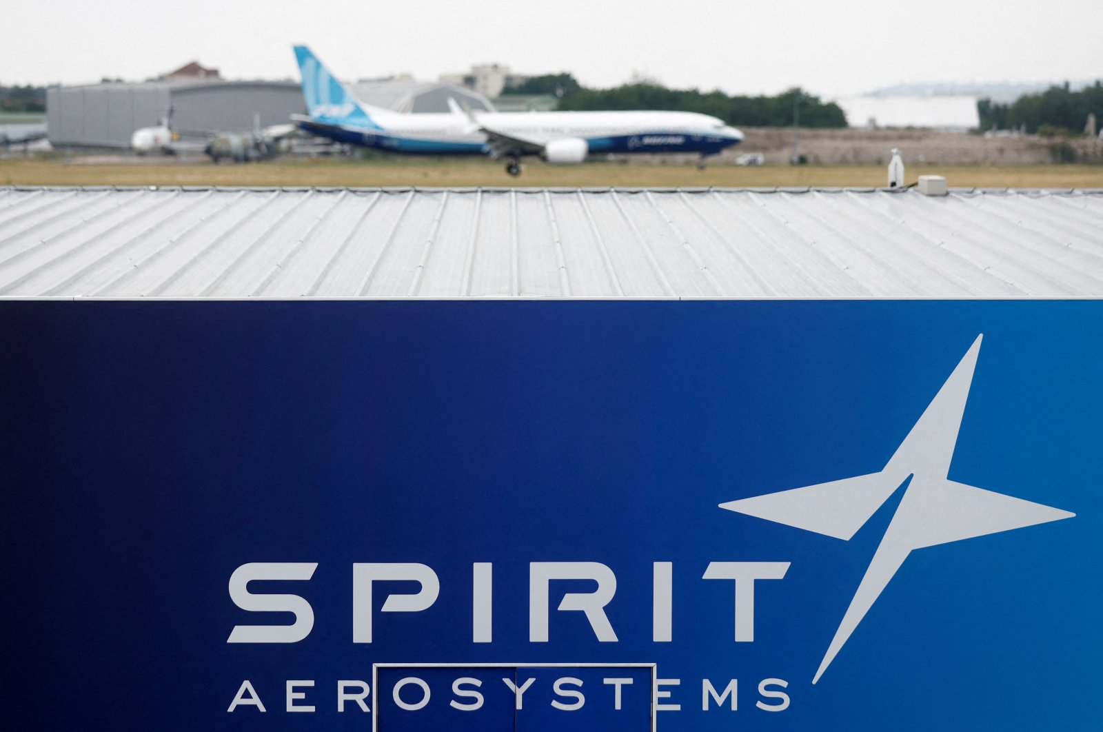 A Boeing 737 Max-10 lands over the Spirit AeroSystems logo during a flying display at the 54th International Paris Air Show at Le Bourget Airport, Paris, France, June 22, 2023. (Reuters Photo)
