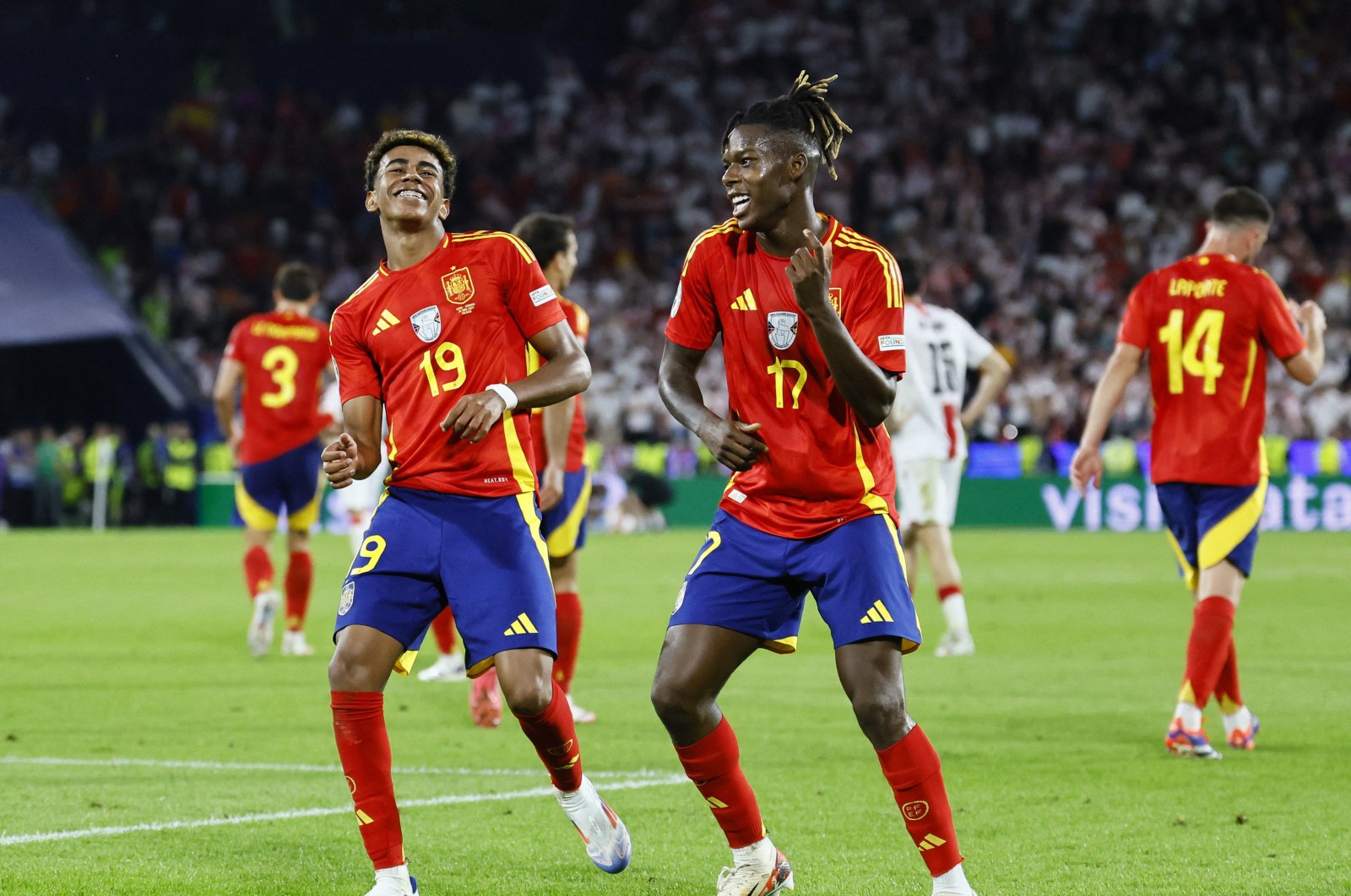 Spain&#039;s Nico Williams (L) celebrates scoring their third goal with Lamine Yamal during the Euro 2024 round of 16 match against Georgia at the Cologne Stadium, Cologne, Germany, June 30, 2024. (Reuters Photo) 