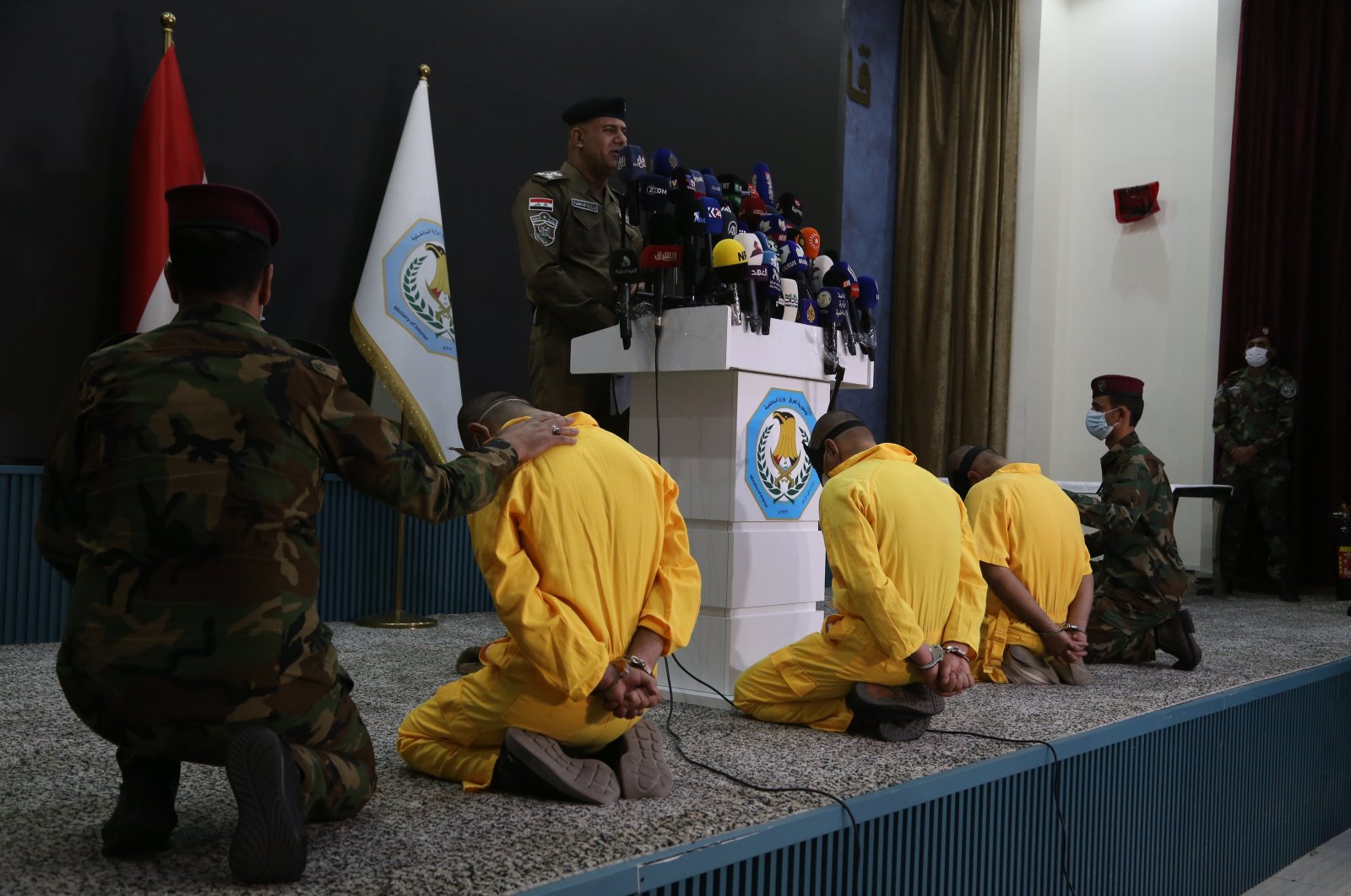 Iraqi Interior Ministry spokesman speaks at the news conference, in front of captured suspects, in Baghdad, Iraq, July 1, 2024. (AA Photo)