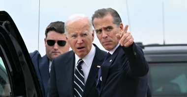 U.S. President Joe Biden (C) talks with his son Hunter Biden (R) upon arrival at Delaware Air National Guard Base in New Castle, Delaware, U.S., June 11, 2024. (AFP Photo)