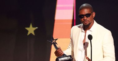 U.S. singer-songwriter Usher accepts the Male R&amp;B / Pop Artist award onstage during the 2024 BET Awards at the Peacock Theater, Los Angeles, U.S., June 30, 2024. (AFP Photo)