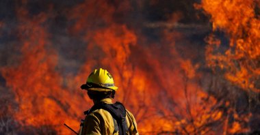 A firefighter works to extinguish the Highland Fire, a wind-driven wildfire near Aguanga, California, U.S., Oct. 31, 2023. (Reuters Photo)