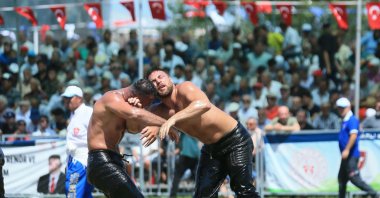 Wrestlers in action during the 16th Sekapark Golden Belt Oil Wrestling, organized by Kocaeli Metropolitan Municipality at Kocaeli Athletics Track, Kocaeli, Türkiye, June 23, 2024. (AA Photo)