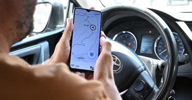 Lebanese Uber driver Hussein Khalil shows his GPS jammed geolocation on the Uber application showing the area of Hermel in eastern Bekaa valley, Lebanon, June 11, 2024. (AFP Photo)