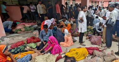 People mourn next to the bodies of stampede victims outside a hospital in Hathras district, Uttar Pradesh, India, July 2, 2024. (Reuters Photo)