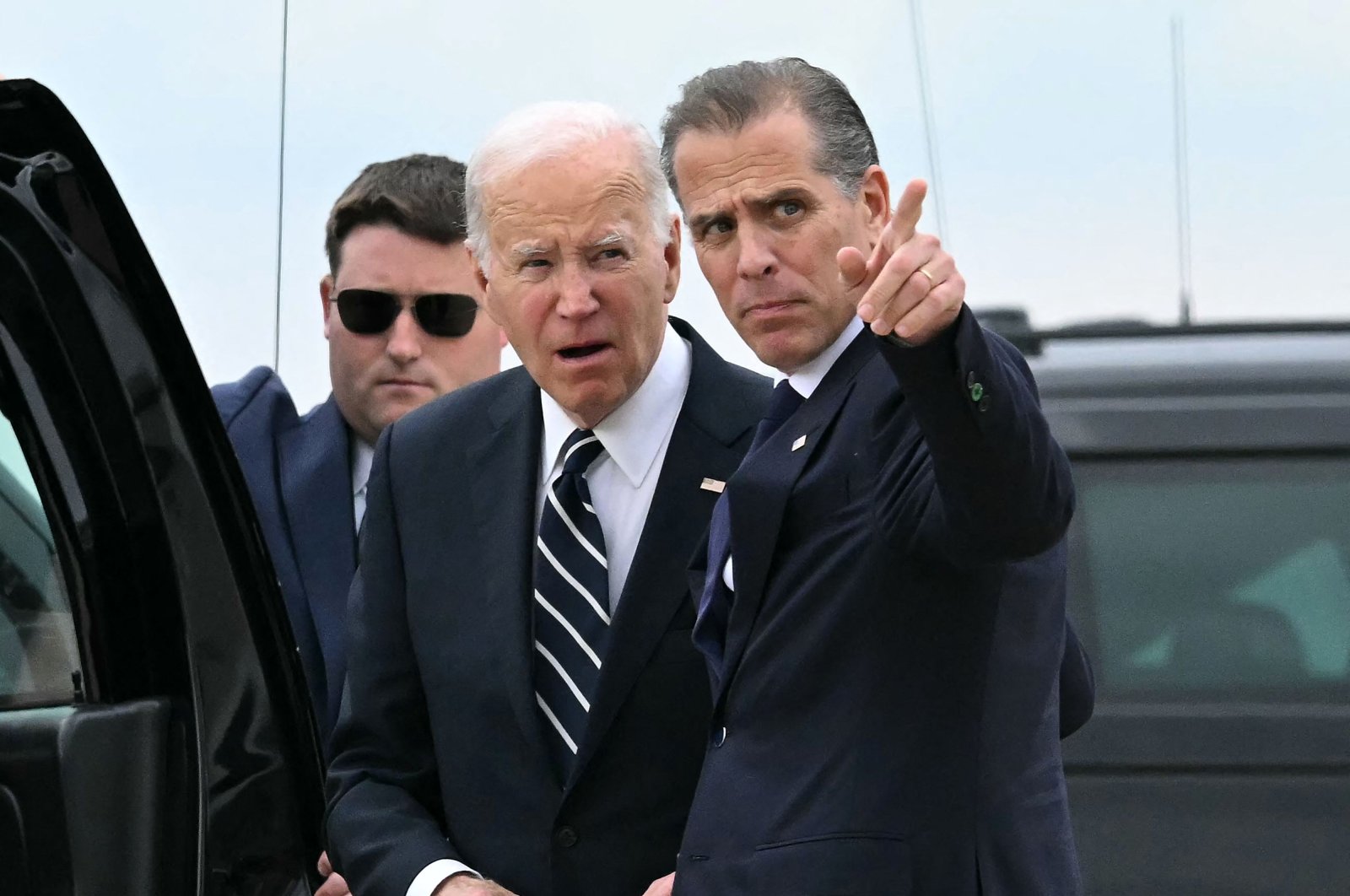 U.S. President Joe Biden (C) talks with his son Hunter Biden (R) upon arrival at Delaware Air National Guard Base in New Castle, Delaware, U.S., June 11, 2024. (AFP Photo)