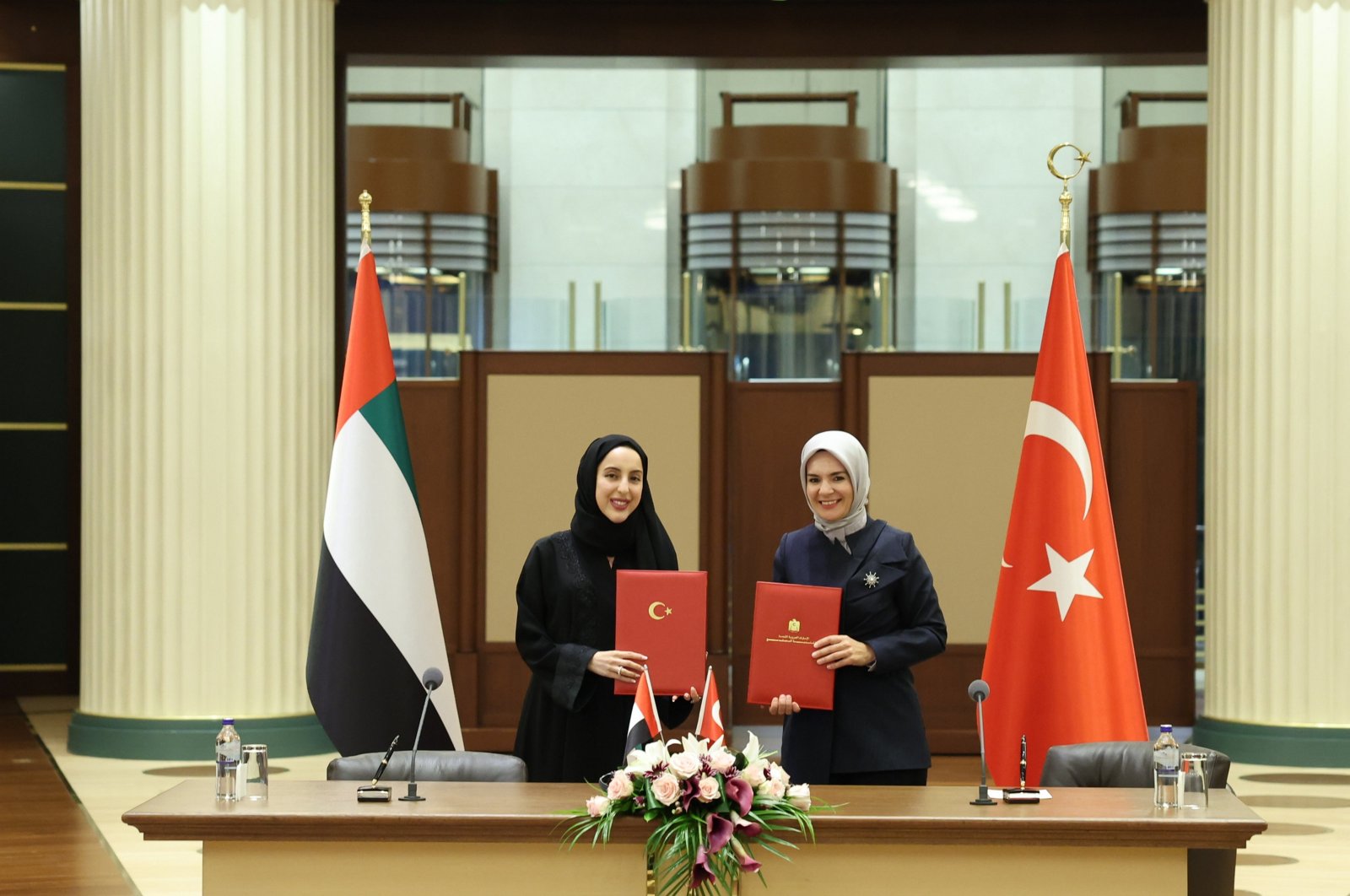 Family and Social Services Minister Mahinur Özdemir Göktaş (R) and Emirati Minister Shamma bint Suhail Al Mazrouei sign a memorandum of understanding, Ankara, Türkiye, July 2, 2024.