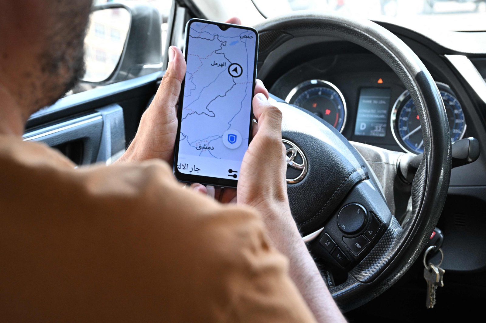 Lebanese Uber driver Hussein Khalil shows his GPS jammed geolocation on the Uber application showing the area of Hermel in eastern Bekaa valley, Lebanon, June 11, 2024. (AFP Photo)