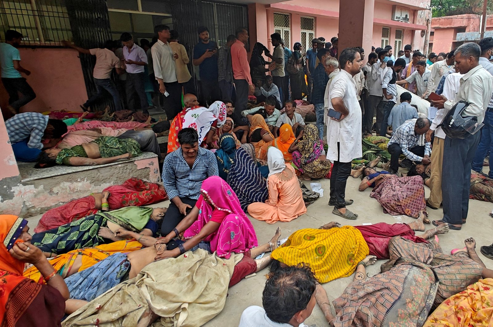 People mourn next to the bodies of stampede victims outside a hospital in Hathras district, Uttar Pradesh, India, July 2, 2024. (Reuters Photo)
