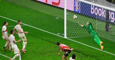 Türkiye&#039;s goalkeeper Mert Günok saves the ball during the UEFA Euro 2024 round of 16 football match between Austria and Türkiye at the Leipzig Stadium in Leipzig, Germany, July 2, 2024. (AFP Photo)