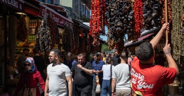 Local shoppers, pedestrians and tourists walk through the old bazaar and market areas of the Eminönü neighborhood in Fatih, Istanbul, Türkiye, June 15, 2024. (Reuters Photo)