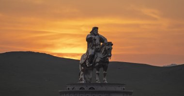 The sun sets over a 40-meter (130-foot) stainless steel statue of Genghis Khan, a national hero who amassed power to become the leader of the Mongols in the early 13th century on the outskirts of Ulaanbaatar, Mongolia, July 1, 2024. (AP Photo)