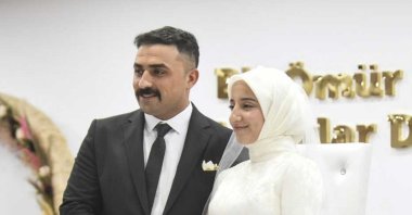 Cebrail Sarsılmaz and Sinem Kaynak, whom he rescued from the rubble of an apartment in Kahramanmaraş, pose for a photo after their wedding, Ankara, Türkiye, June 3, 2024. (AA Photo)