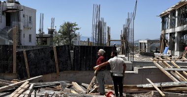 Construction workers are photographed on a site in the Bodrum district of Muğla province, southwestern Türkiye, June 4, 2024. (DHA Photo)