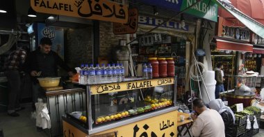 Customers eat in a Syrian restaurant in Fatih district, Istanbul, Türkiye, April 29, 2023. (AP Photo)