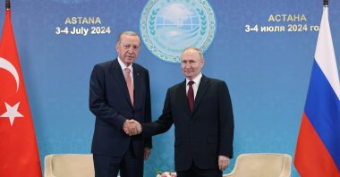 President Recep Tayyip Erdoğan (L) shakes hands with Russian President Vladimir Putin, Astana, Kazakhstan, July 3, 2024. (AA Photo)