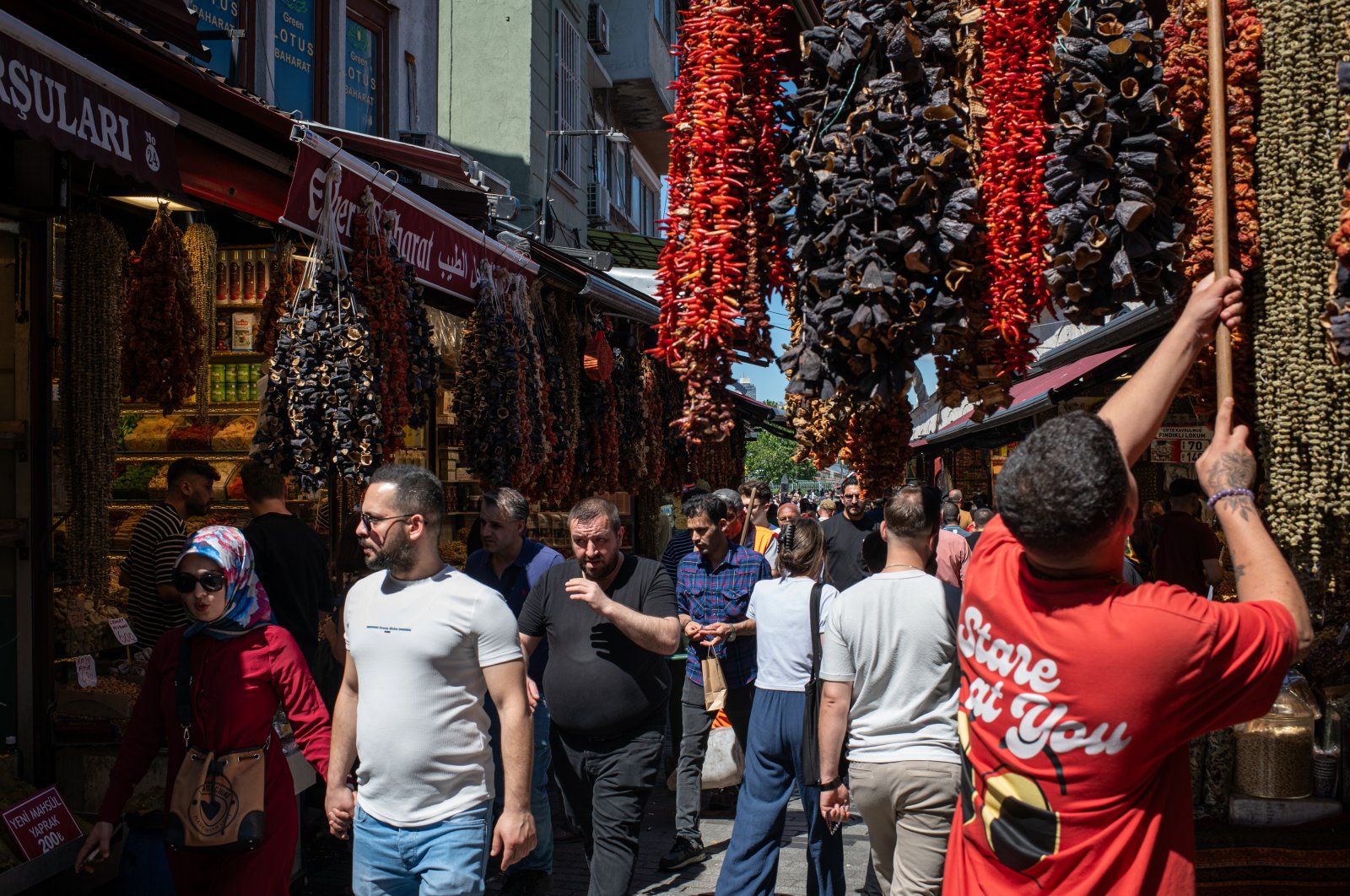Local shoppers, pedestrians and tourists walk through the old bazaar and market areas of the Eminönü neighborhood in Fatih, Istanbul, Türkiye, June 15, 2024. (Reuters Photo)