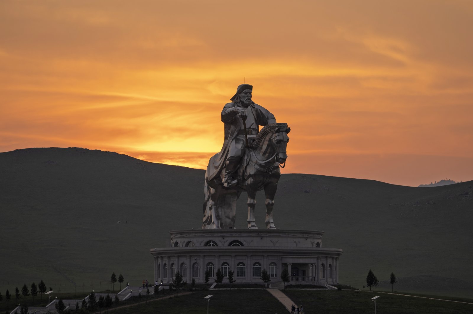 The sun sets over a 40-meter (130-foot) stainless steel statue of Genghis Khan, a national hero who amassed power to become the leader of the Mongols in the early 13th century on the outskirts of Ulaanbaatar, Mongolia, July 1, 2024. (AP Photo)